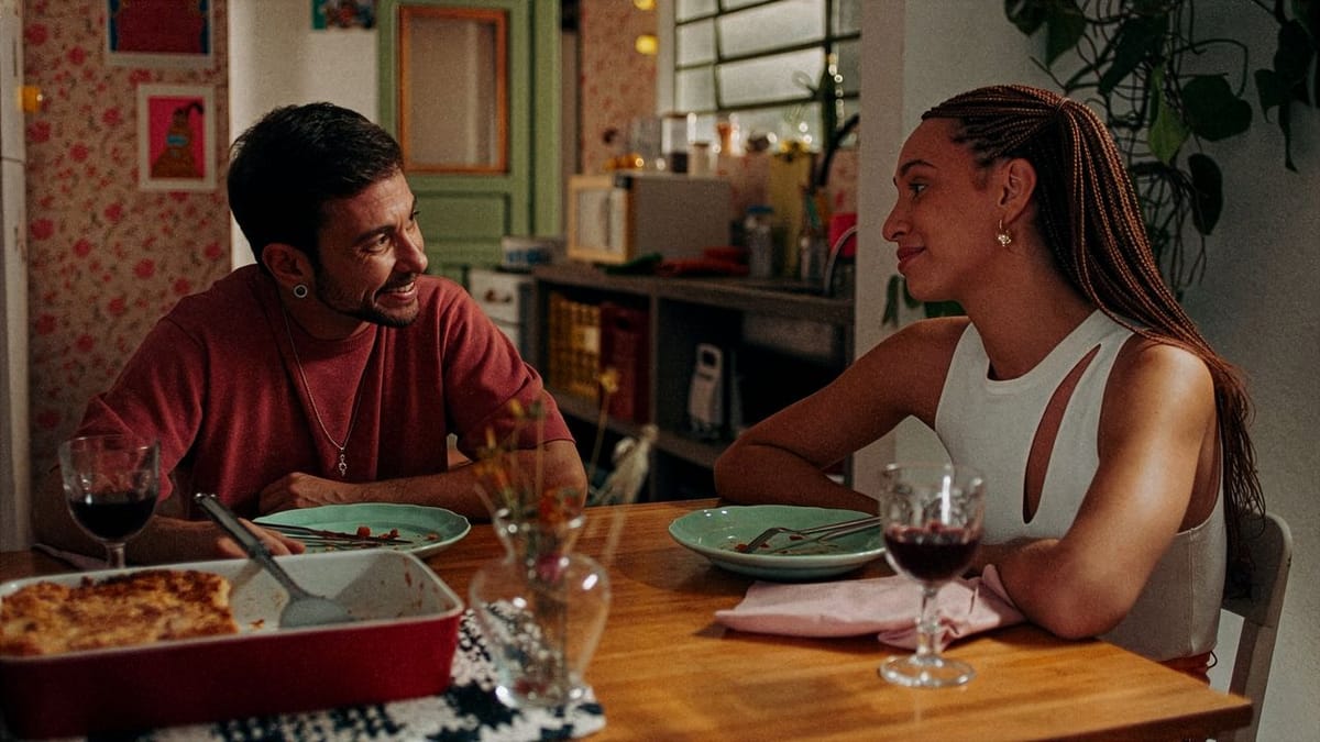 A still from the film I Am Going To Miss You, showing the two main characters sitting at a dinner table during a