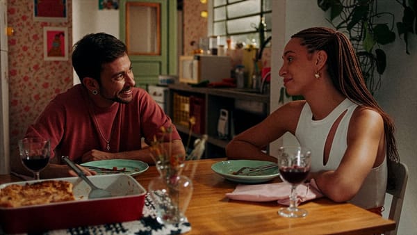 A still from the film I Am Going To Miss You, showing the two main characters sitting at a dinner table during a
