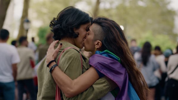 The film's protagonist, Anahita, kisses her girlfriend at a protest.